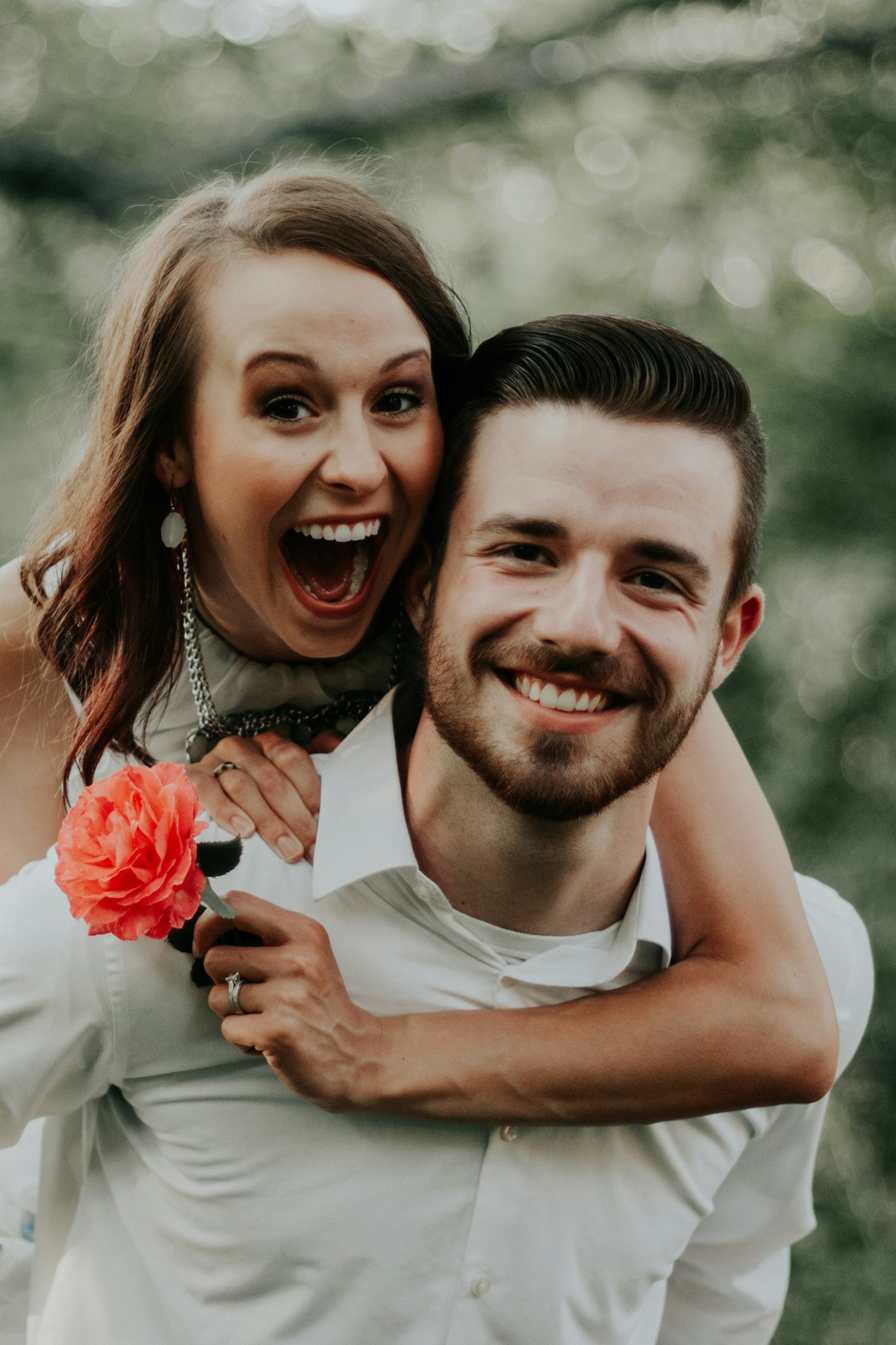 Delighted couple smiling together outdoors