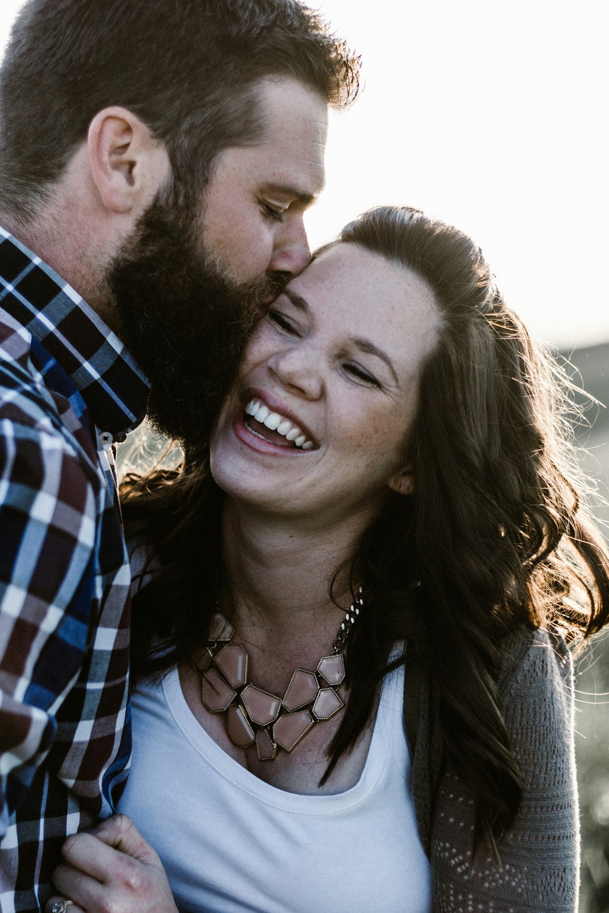 Couple sharing a warm moment outdoors